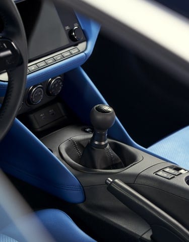 Gear shift and console of a 2024 Nissan Z with blue interior