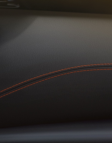 2024 Nissan Kicks interior view of dashboard highlighting contrast stitching