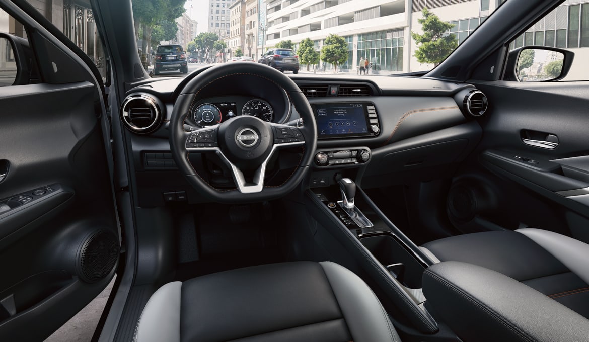 2024 Nissan Kicks interior view of heated front seats and steering wheel
