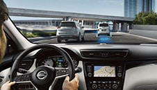 2023 Nissan Qashqai in Caspian Blue showing advanced Driver assist technology on the road