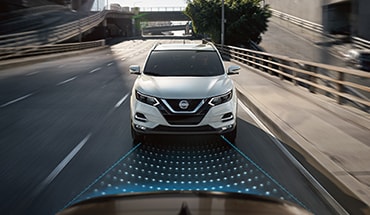 2023 Nissan Qashqai on the road showing automatic emergency braking with pedestrian detection technology