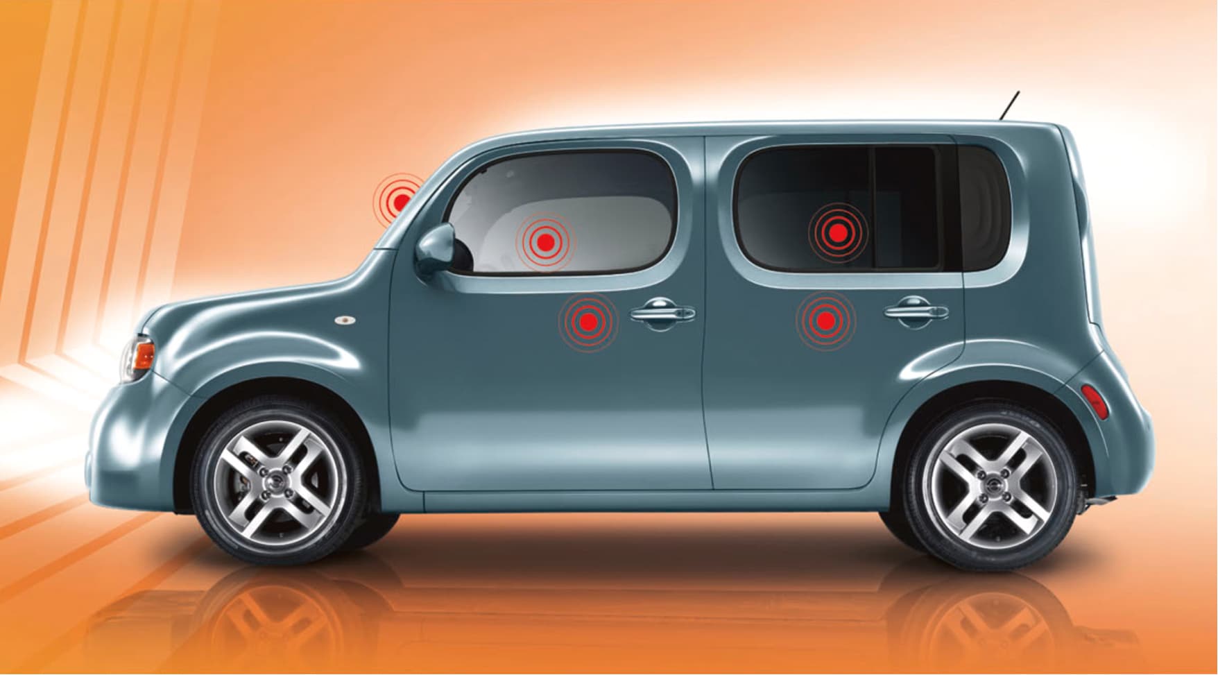 Nissan Cube on orange background with red dots to demonstrate safety features
