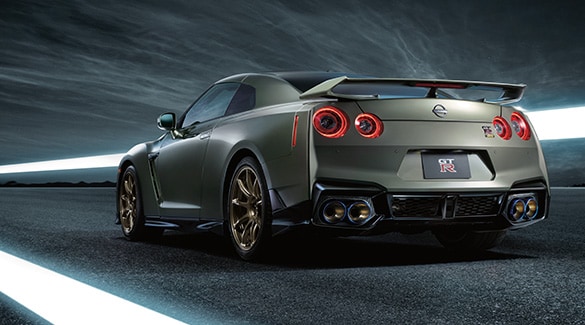 2024 Nissan GT-R driving through a well-lit tunnel.