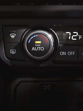 2024 Nissan GT-R climate control panel with etched aluminum bezels.
