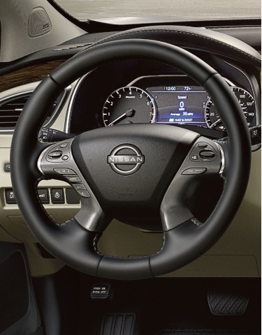 Front seat view of a 2024 Nissan Murano showing off premium finishes, center console, and dashboard