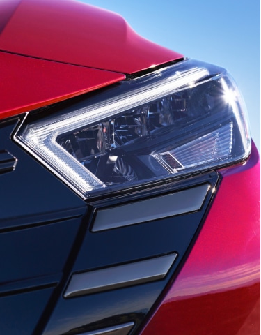 Exterior close up view of 2024 Nissan Versa LED headlights